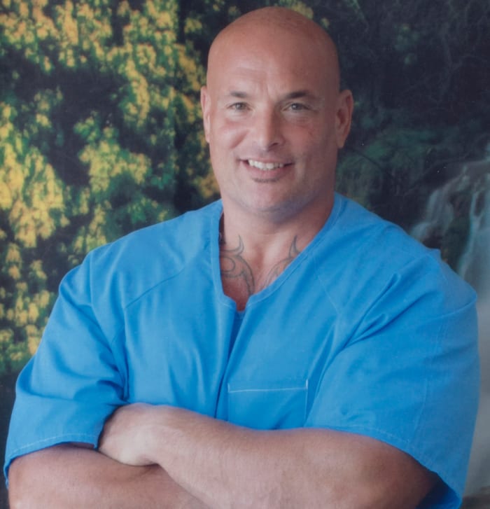 Naposki poses for a photo in his prison uniform in 2017.